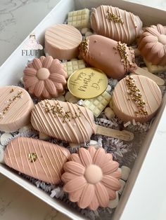 a box filled with lots of different shaped cookies