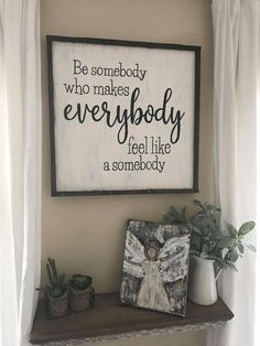 a sign that says be somebody who makes everybody feel like a somebody above a shelf