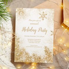 an elegant holiday party with gold glitter and snowflakes on the front, along with pine branches