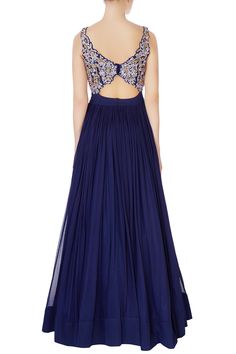 This luxurious and swanky midnight blue super flared anarkali gown will command attention anywhere you go! The bodice is exquisitely hand embroidered with resham thread, bugle beads and intricate dabka embroidery. The anarkali comes along with an embroidered dupatta with tassel borders. 
Super flared anarkali
Cutout at midriff
Sleeveless
Hand embroidery
Resham threadwork with bugle beads and dabka work - Aza Fashions Floor-length Choli For Evening Eid, Floor-length Choli For Eid Evening, Floor-length Choli For Evening Eid Celebration, Floor-length Evening Choli For Eid, Evening Gown With Zari Work For Diwali, Evening Gown With Resham Embroidery For Diwali, Formal Floor-length Choli With Mirror Work, Bollywood Style Floor-length Anarkali Set For Evening, Embellished Anarkali Set For Evening