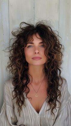 Elevate your curls with these 24 beautiful curly hairstyles that women are loving right now. From curly hair highlights to voluminous cuts, save this pin for curly hair inspiration! Feathered Bangs Curly Hair, Curly Wavy Brown Hair With Highlights, Diamond Shape Curly Haircut, Odessa A'zion Curly Hair, Curly Hair Haircuts Layers, Long Shaggy Haircuts Curly Hair, Curly Hair Styles For Square Face Shape, Side Parting Curly Hair, Curly Hairstyles To Hide Big Forehead