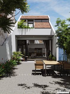 an outdoor dining area with table and chairs