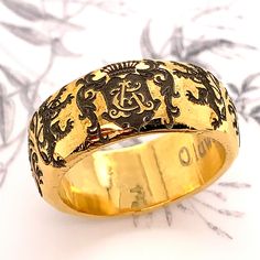 This unique Personalized Family Crest Handmade Sterling Silver Wedding Band is more like a work of art than a piece of jewelry. It can be customized with your initials in victorian style monogram. The ring measures 11mm in width. The profile of the ring is dome with hammered texture. The ring is custom made by order. Please confirm your finger size with the local jeweler before placing the order. This bohemian style Unisex Wedding Ring can make a perfect Wedding Band, Anniversary Ring and Promis Luxury Engraved Wide Band Ring For Anniversary, Luxury Wide Band Engraved Ring For Anniversary, Luxury Engraved Open Ring For Wedding, Symbolic Yellow Gold Engraved Wedding Ring, Symbolic Engraved Yellow Gold Ring For Wedding, Symbolic Yellow Gold Engraved Ring For Wedding, Luxury Wide Band Engraved Ring For Wedding, Luxury Engraved Wide Band Promise Ring, Wedding Engraved Ring With Initials