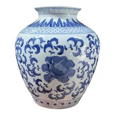 a large blue and white vase with flowers on it's sides, against a white background