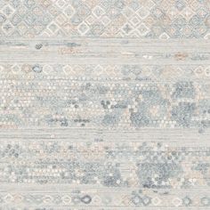 an area rug with different colors and patterns on it, including blue, grey, beige and white