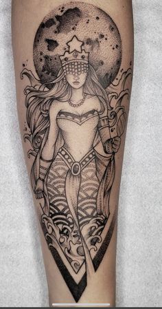 a woman's leg with a tattoo on it