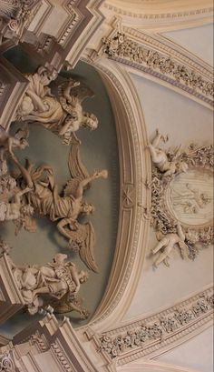 an ornate ceiling with sculptures on it