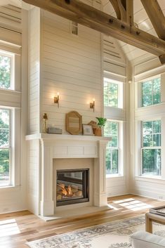 a living room with a fire place in the center and two windows on both sides