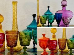 several different colored glass vases sitting next to each other