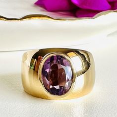 Modernist Solid 18k Yellow Gold Genuine Amethyst Ring, Sz 6.75* This beautiful ring is made of solid 18k yellow gold and has a modernist design with a beautiful, natural, amethyst gemstone measuring 8mmx 10mm (1.95ct) bezel-set at the center. The amethyst has a medium purple tone with good color saturation and clarity. This ring is pre-owned and seems to have been sized down at some point, it is a size 6.75 and weighs 5.8 grams. The ring mounting is very strong; it has been tested and is guarant Purple Tone, Hand Rings, Fine Gold Jewelry, Lapis Lazuli Pendant, Modernist Design, Pattern Ring, Right Hand Rings, Medium Purple, Beautiful Ring