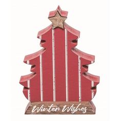 a wooden christmas tree with the word winter wishes written on it's bottom half