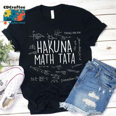 a black shirt with the words hakuna math tata written in white on it