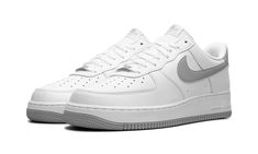 The Nike Air Force 1 Low “White/Light Smoke Grey” is a versatile colorway of the retro basketball shoe with grey details.  The Air Force 1 Low “White/Light Smoke Grey” is complete with a white leather base and white leather overlays on the toe, forefoot, eyelets, collar, and heel.  A Light Smoke Grey Swoosh logo appears on the sides, and a “Nike Air” logo is embroidered on the grey leather heel tab.  An “Air Force 1” logo appears on the tongue tag, while a silver “AF1” lace dubrae can be seen on Gray Low-top Nike Air Force 1 For Sports, Classic Nike Air Force 1 Low-top With White Sole, White Nike Air Force 1 Low-top With Air Cushioning, White Low-top Nike Air Force 1 With Branded Insole, White Synthetic Low-top Nike Air Force 1, Air Logo, Crocs Boots, Retro Basketball Shoes, Nike Airforce 1