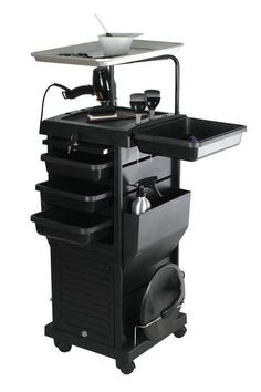 a black cart with two trays on top of it and an electronic device in the middle