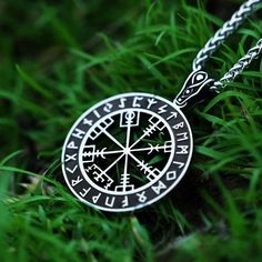 Find your way with this Viking jewelry necklace featuring the ancient Vegvisir. As a Norse symbol of guidance, this runic compass pendant provided protection for brave explorers. The meaningful Vegvisir design will inspire you to stay on course towards your goals and remain true to your inner compass. Expertly engraved onto a rounded silver charm, it hangs from an adjustable leather cord. Handcrafted with care by our artisans, each sustainable necklace is unique. Whether you have Scandinavian ro Black Compass Design Jewelry Gift, Symbolic Compass Design Necklace As Gift, Symbolic Compass Design Necklace Gift, Handmade Viking Style Jewelry For Outdoor, Spiritual Compass Pendant Jewelry, Spiritual Compass Pendant Necklace, Outdoor Engraved Medallion Necklace, Amulet Style Compass Pendant Necklace, Black Viking Jewelry For Outdoor