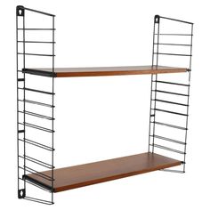 two wooden shelves with metal brackets on each side and one shelf holding bookshelves