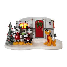 mickey mouse and friends in front of a camper ornament with christmas trees