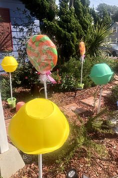 several different colored plastic objects in the yard