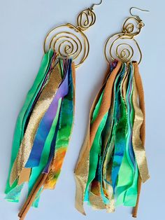 These hand crafted multi-color fabric earrings were inspired by and created for artistic women who value unique and creative self-expression - Each earring is crafted with 16 gauge premium copper gold wire into 2 golden swirls and multi-colored, cotton, knit, polyester, silk and rayon shredded fabric pieces are woven through the bottom - Each type of fabric is carefully selected with artistic eyes to compliment and bring out the radiant color dynamic and pattern of the unique fabrics -  We accep Handmade Bohemian Multicolor Wrap Earrings, Artsy Green Earrings For Festival, Artsy Green Earrings For Party, Green Artsy Earrings For Party, Bohemian Green Wrap Earrings, Artistic Green Earrings For Festival, Shredded Fabric, Diy Yarn Earrings, Cloth Earrings