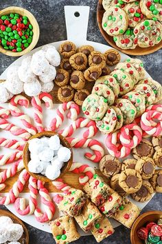 an assortment of cookies and candy on a platter