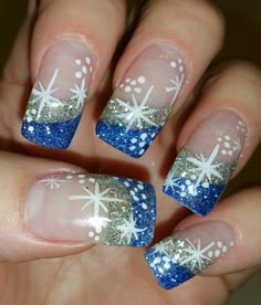 Blue and silver starry night holiday french tip nail art. Holiday Nail Designs Winter French Tips, Winter French Tips, Holiday Nail Designs Winter, Jan Nails, 2025 Nails, Nail Designs Winter, French Tip Nail Art, Nails For Fall, Ombré Nails