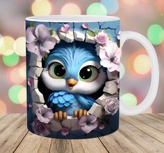 a coffee mug with an image of a blue owl