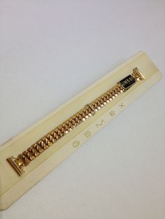 Brand New Expertly Crafted Vintage Gemex Gold-Tone Stretch Bracelet Watch Band. 13mm  Fancy Link Stretch Bracelet Band w/ Elegant Lugs. Made In U.S.A. Approx. 5 1/2" length before being stretched. Comes in original Gemex Watch Display. Discovered these Vintage Watch Bands in watchmakers old shop inventory and listed them at extremely low prices, will enrich any timepiece!!! USPS FIRST CLASS MAIL INSURED W/ TRACK #. Please check my other auctions for more Brand Name Luxury & Vintage watch bands in several different colors & sizes. Gold Bracelet Strap Watch Bands For Formal Occasions, Adjustable Gold Metal Watch Bands, Classic Gold Band Bracelet, Gold Adjustable Watch Extender, Vintage Gold Watch Bands For Formal Occasions, Classic Gold Jewelry And Watches With Bracelet Strap, Gold Jewelry Bracelet Band, Gold Adjustable Metal Watch Accessories, Antique Gold Bracelet Strap Jewelry