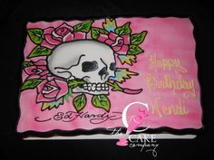 a pink birthday cake with a skull and flowers on it's side that says happy birthday to you