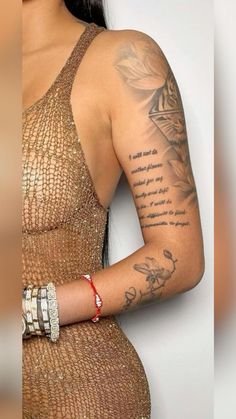 a woman with tattoos on her arm holding a cell phone