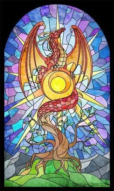 a dragon sitting on top of a tree next to a sun in a stained glass window