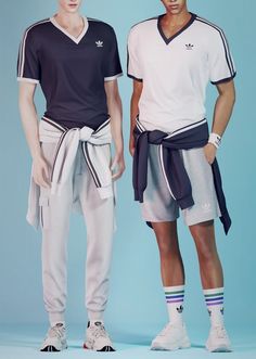 two young men standing next to each other wearing adidas shorts and t - shirts