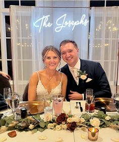 a bride and groom pose for a photo at their wedding dinner table with the words, the josephs on it