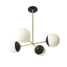 a black and white chandelier with three balls hanging from it