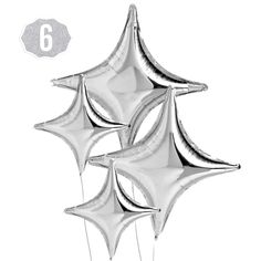 four silver foil balloons in the shape of five stars, each with a number six on it