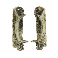 pair of door handles made from ceramic with black speckles and white paint on them