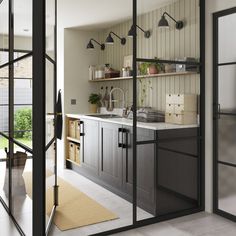 an open kitchen with sliding glass doors leading to the outside