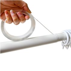 a person is pulling something with their hand on a white object that looks like a circle