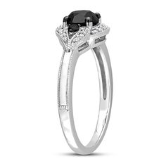 a black and white diamond engagement ring on a white background with the center stone surrounded by diamonds