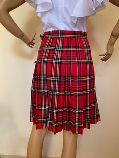 "This beautiful tartan skirt is made from fine soft viscose fabric. Knee lenght 55 cm. Wrap front and pleated full back. SIZE CHART SIZE S - US 6, UK 8, EU 36 bust: bust around 34.5\"/90cm Waist: waist around 27.5\"/70cm Hips: hips around 34.5\"/90cm SIZE M - US 8, UK 10, EU 38 bust: bust around 37.5\"/95cm Waist: waist around 29.5\"/75cm Hips: hips around 37.5\"/95cm SIZE L - US 10, UK 12, EU 40 bust: bust around 39.5\"/100cm Waist: waist around 31.5\"/80cm Hips: hips around 39.5\"/100cm SIZE X Fitted Knee-length Pleated Skort, Fitted Plaid Pleated Mini Skirt, Plaid Pleated Mini Skirt School Uniform, Plaid Pleated Skort For School Uniform, Plaid Pleated Skirt For School Uniform, Fitted Pleated Plaid Mini Skirt, Fitted Plaid Mini Skirt, Fitted Pleated Plaid Bottoms, Plaid School Uniform Skort