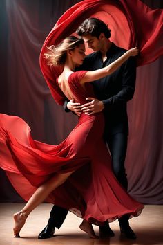 a man and woman in red dress dancing with their arms around each other while wearing black shoes