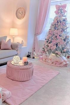 a living room decorated in pink and white with a christmas tree next to the couch