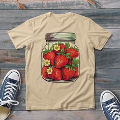 Discover the joy and whimsy of our strawberry tees, an essential addition to your coquette clothing collection. Each shirt, lovingly crafted, is not just a garment but a celebration of the delightful strawberry season. Our shirt's vibrant and playful strawberry design captures the essence of fruit-themed fashion, making it perfect for outings to strawberry festivals. It embodies the rustic elegance and simplicity of cottagecore clothing, seamlessly fitting into both your everyday and nature-centric lifestyles. Crafted with high-quality, soft fabric, our botanical shirt offers comfort for all-day wear. Its versatile design is ideal for various occasions, from casual meet-ups to active gardening sessions. As a gardening shirt, it's light and breathable, allowing free movement as you tend to Cute Strawberry Print T-shirt As Gift, Vintage Strawberry Print Short Sleeve T-shirt, Sweet Summer T-shirt As Gift, Sweet T-shirt For Summer Gift, Strawberry Shirt, Strawberry Season, Strawberry Design, Strawberry Topping, Botanical Shirt