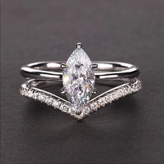 This Ring Set Is Absolutely Stunning! Two Piece Set Features: 925 Stamped Sterling Silver With Rhodium Plating To Enhance Its Color. Main Stone Is A Full 2ct 5a Cz V Shaped Ring Has Gorgeous Pave Simulated Diamonds This Ring Set Has Incredible Clarity And Sparkle! Has The Look Of Real Diamonds This Is A High Quality Forever Ring Set That Will Keep Its Sparkle And Shine All Sizes Available From 5 -11 Includes Beautiful Gift Box Other Listings: Engagement Rings Diamond Bands 10k 14k 18k Gold White Gold Platinum Rose Gold Earrings Necklaces Bracelets Bridal Promise Wedding Prom Emerald Sapphire Micro Pave Natural Gemstones Vintage 925 Sterling Silver Classic Retro Contemporary Pear Marquise Engagement Ring White Gold, V Shaped Ring, Marquise Wedding Ring, Forever Ring, Diamond Band Engagement Ring, Marquise Diamond Engagement Ring, Engagement Rings Diamond, Platinum Rose Gold, Engagement Rings Marquise