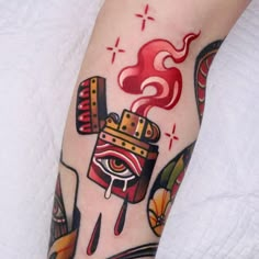 a person with a tattoo on their leg has a hot dog and ketchup