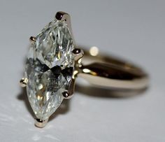 an engagement ring with two pear shaped diamonds