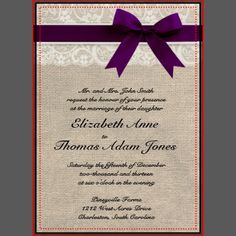 a wedding card with a purple ribbon and bow on the front, in red frame