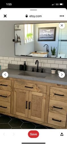 a bathroom vanity with two sinks and a large mirror