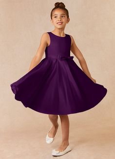 Complete your bridal party with our clean modern Matte Satin flower girl dress, Coco. Her scoop neckline is complimented by a belt with a bow at the front. The skirt is pleated beautifully to flare as she walks down the aisle. This dress is not only perfect for a flower girl at a wedding but also versatile enough for other special occasions. Purple Jr Bridesmaid Dresses, Little Bridesmaids Dresses Kids Purple, Deep Purple Flower Girl Dress, Dark Purple Dresses Kids, Plum Flower Girl Dresses, Girls Short Dresses, Purple Flower Girls, Purple Girls Dress, Purple Flower Girl Dress