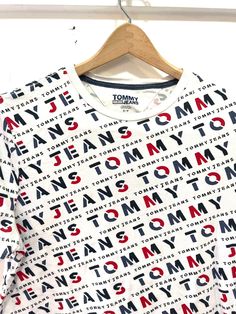 "Vintage Tommy jeans top S/p 19\" underarm to underarm  24\" long 100% cotton See all photos for best description" Affordable Tommy Hilfiger Logo Print T-shirt, Casual Short Sleeve Tops With All Over Print, Casual Short Sleeve Tops With All-over Print, Trendy Short Sleeve Tops With All Over Print, Tan Logo Print Tops For Summer, Summer Tan Tops With Logo Print, Spring Logo Print Short Sleeve Tops, Trendy Relaxed Fit Top With All Over Print, Tan Cotton Top For Streetwear