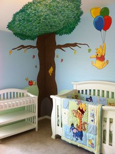 a baby's room with winnie the pooh mural and crib bedding